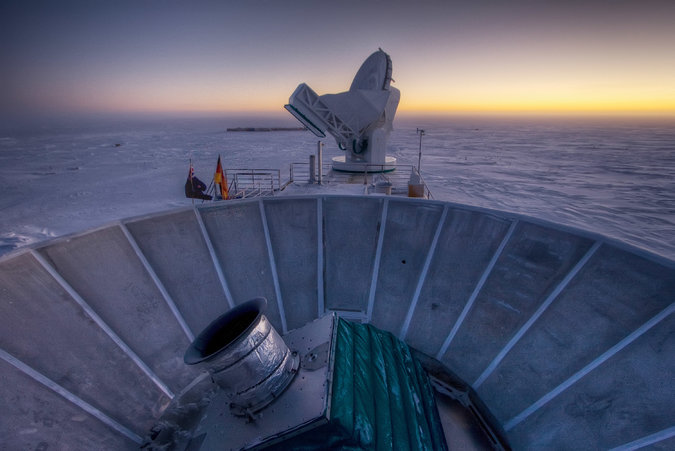 The Bicep2 telescope, in the foreground, was used to detect the faint spiraling gravity patterns — the signature of a universe being wrenched violently apart at its birth.